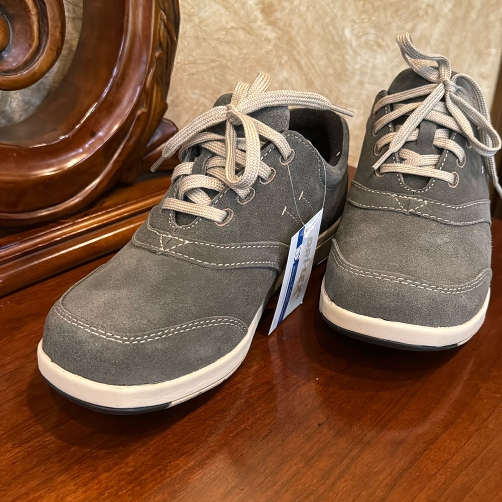 Drew new with a tag sneakers. Size 7. Brand new. Moisture resistant